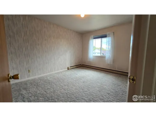 a open space with a sink and closet