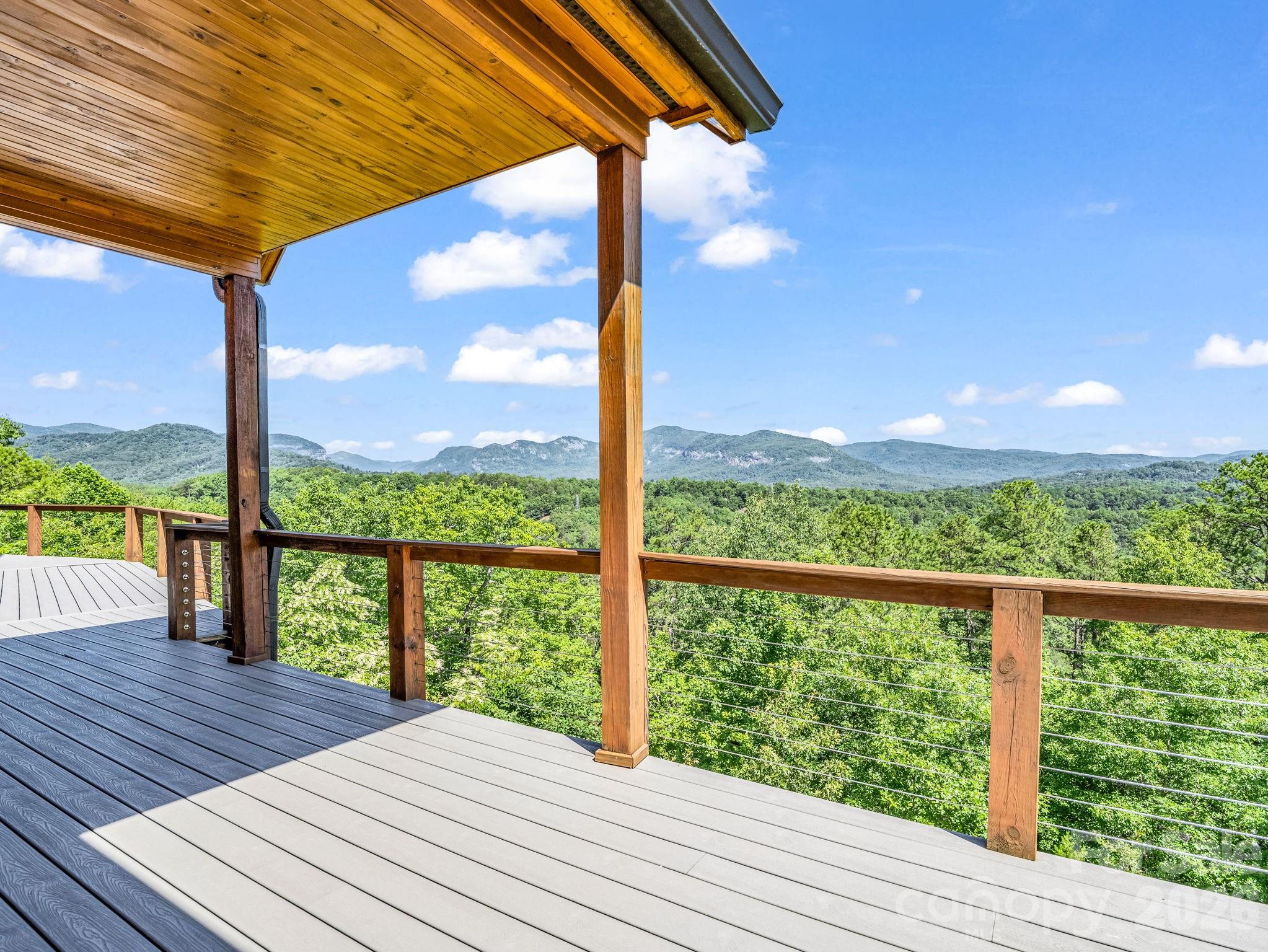 590 Boulder Ridge Lake Lure, NC 28746 - Photo 2 of 48 a view of a balcony with table and chairs