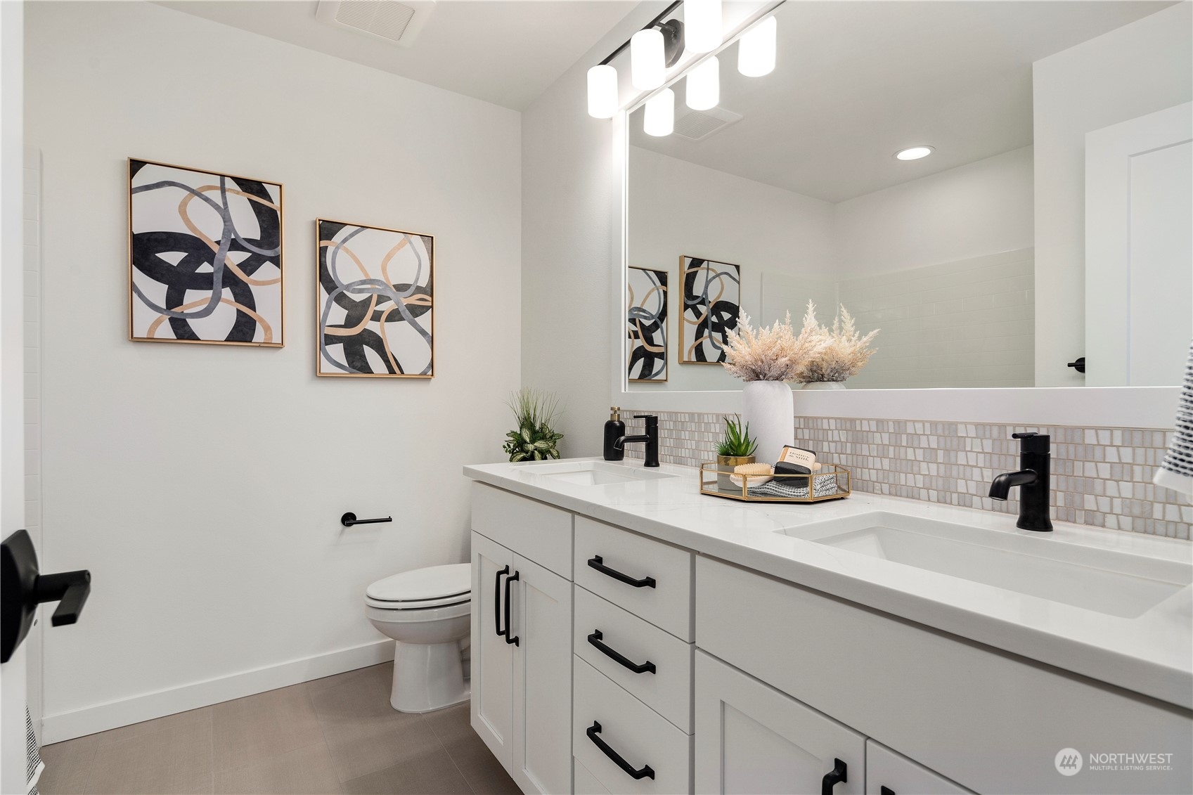 11 179th Place Southwest Bothell, WA 98012 - Photo 29 of 29 a bathroom with a toilet sink and mirror