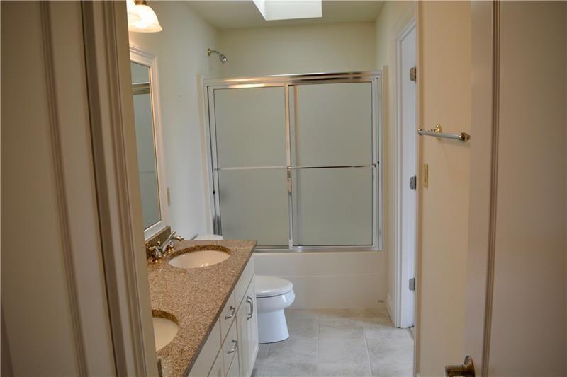 305 Scenic Court Coraopolis, PA 15108 - Photo 16 of 20 a bathroom with a granite countertop sink toilet and shower