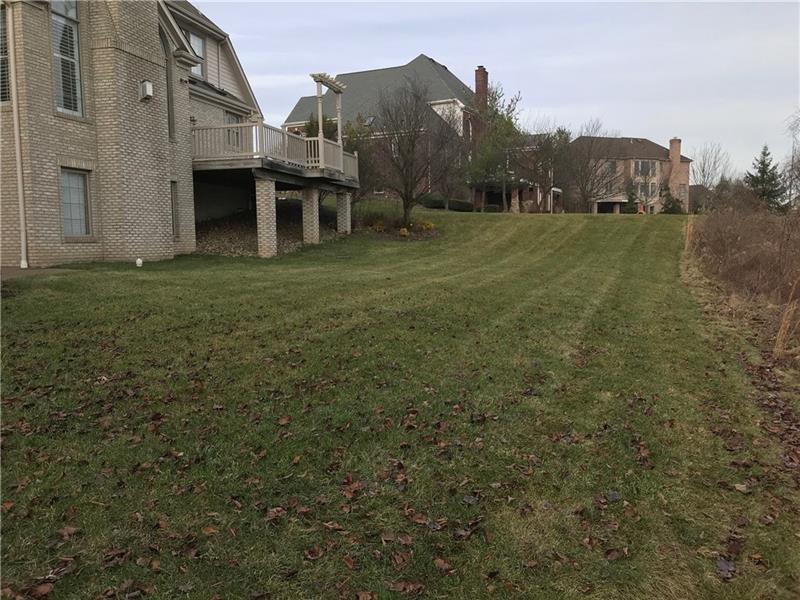 305 Scenic Court Coraopolis, PA 15108 - Photo 20 of 20 a view of a large house with a big yard and large trees