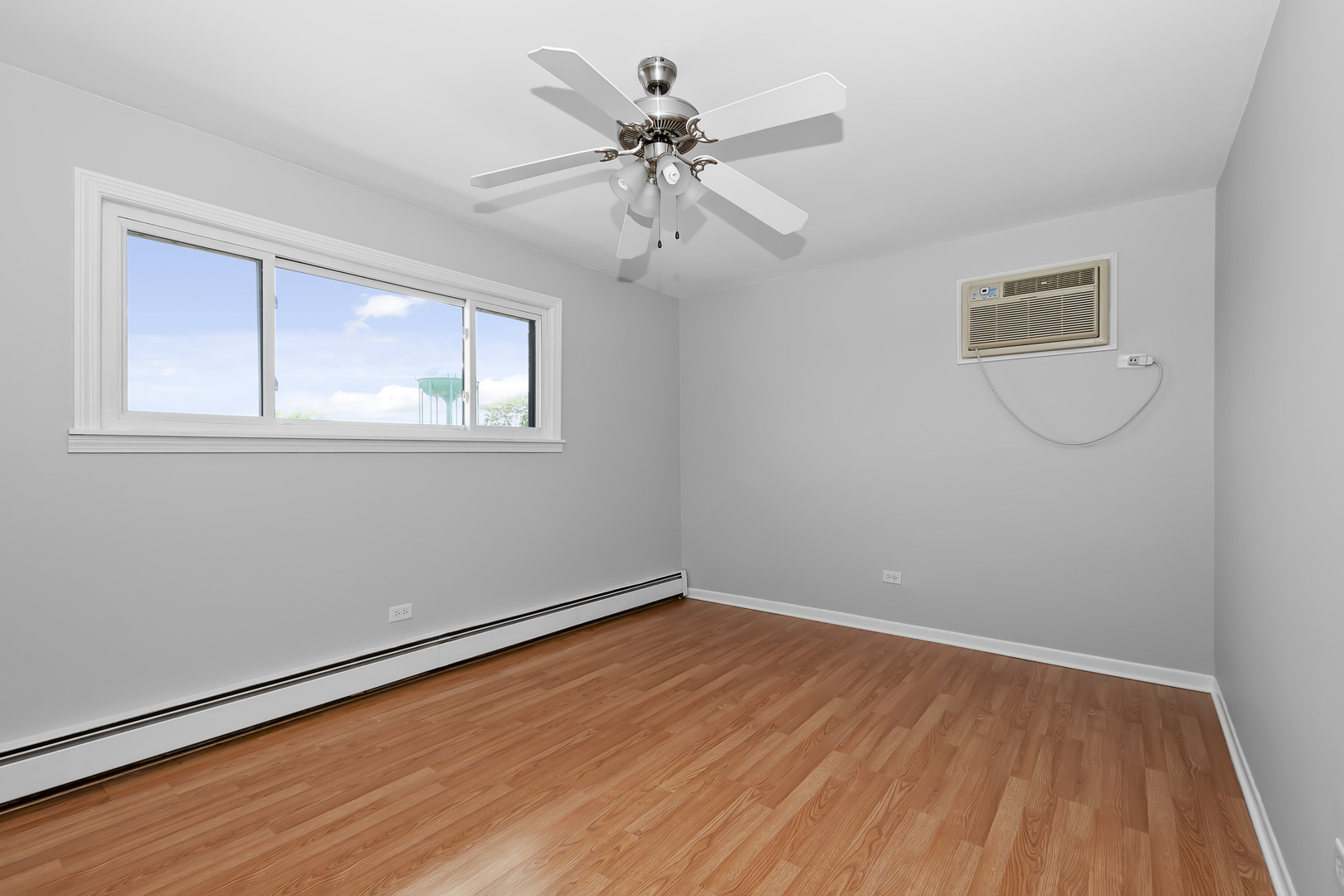 6348 Washington Street, Unit 3A Chicago Ridge, IL 60415 - Photo 9 of 17 wooden floor in an empty room with a window