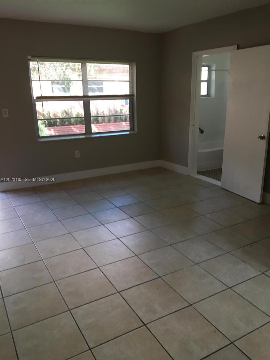 520 Southwest 4th Street, Unit 4 Miami, FL 33130 - Photo 12 of 12 a view of an empty room and a window