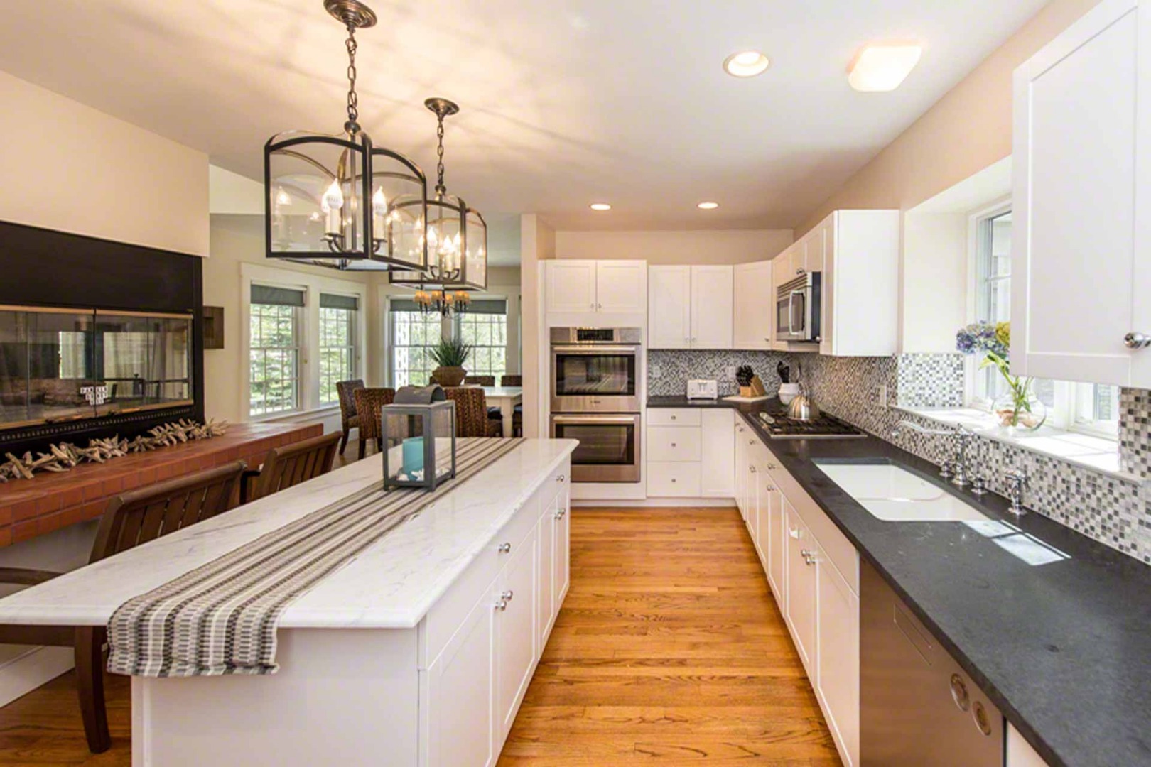 40 Dark Woods Road Edgartown, MA 02539 - Photo 14 of 20 a large kitchen with kitchen island granite countertop a large counter top appliances and cabinets