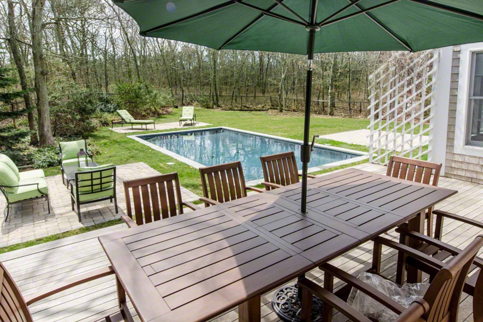 40 Dark Woods Road Edgartown, MA 02539 - Photo 3 of 20 an outdoor space with furniture and umbrella