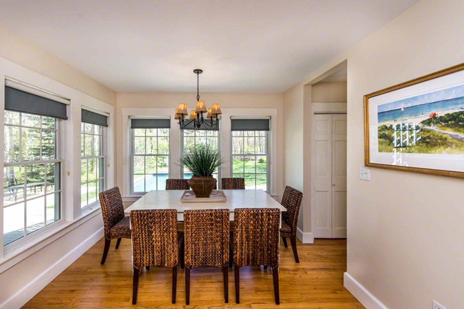 40 Dark Woods Road Edgartown, MA 02539 - Photo 10 of 20 a view of a dining room with furniture a chandelier and wooden floor