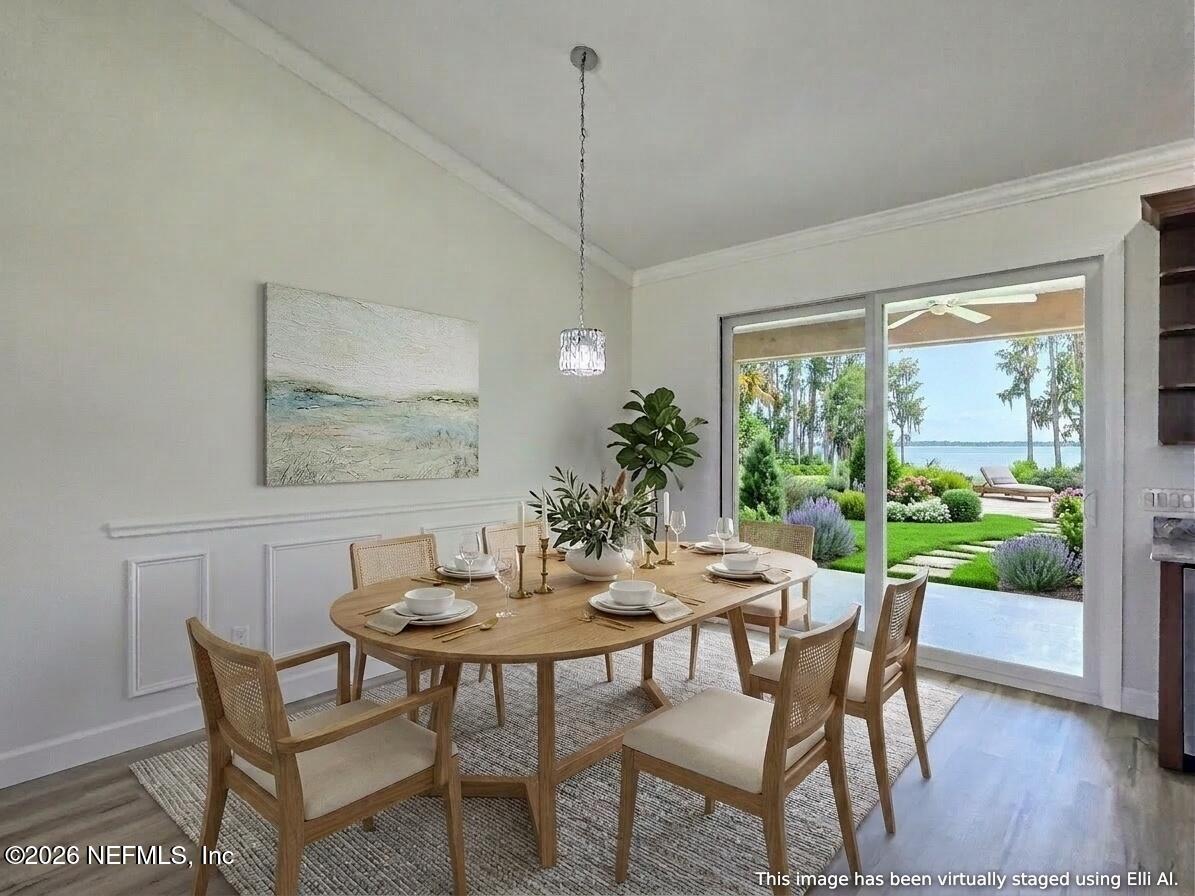 159 Mays Cove Road East Palatka, FL 32131 - Photo 14 of 62 a view of a dining room with furniture window and wooden floor