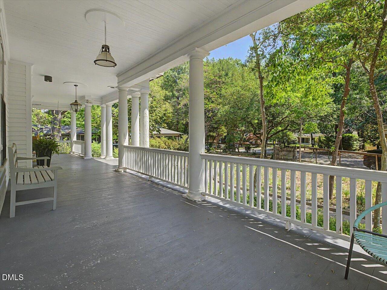 215 Hillcrest Road Raleigh, NC 27605 - Photo 12 of 97 a view of a porch with furniture and garden