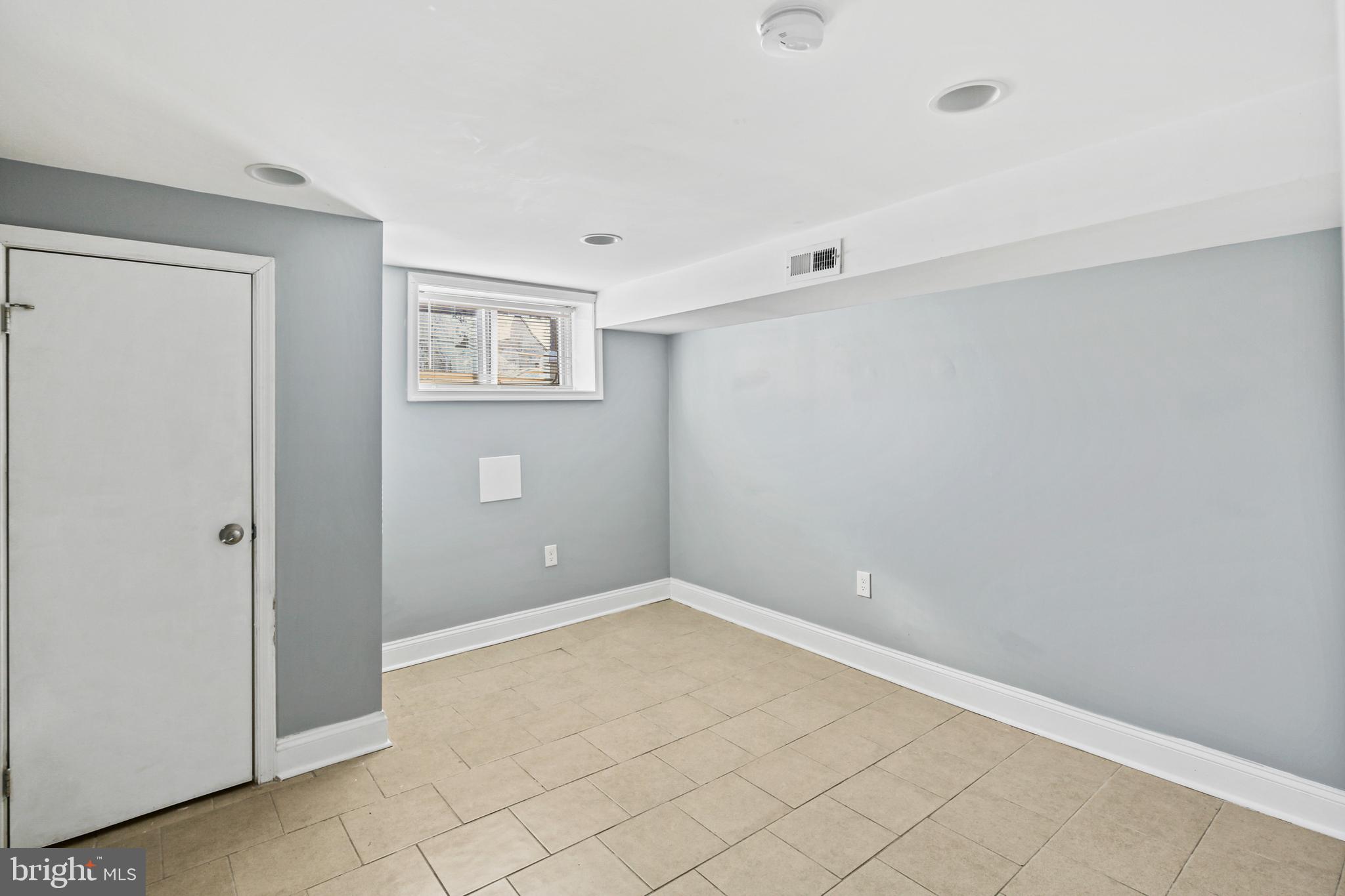 2806 Orleans Street Baltimore, MD 21224 - Photo 20 of 29 Lower Level Bedroom 3 with Ceramic Tile Flooring