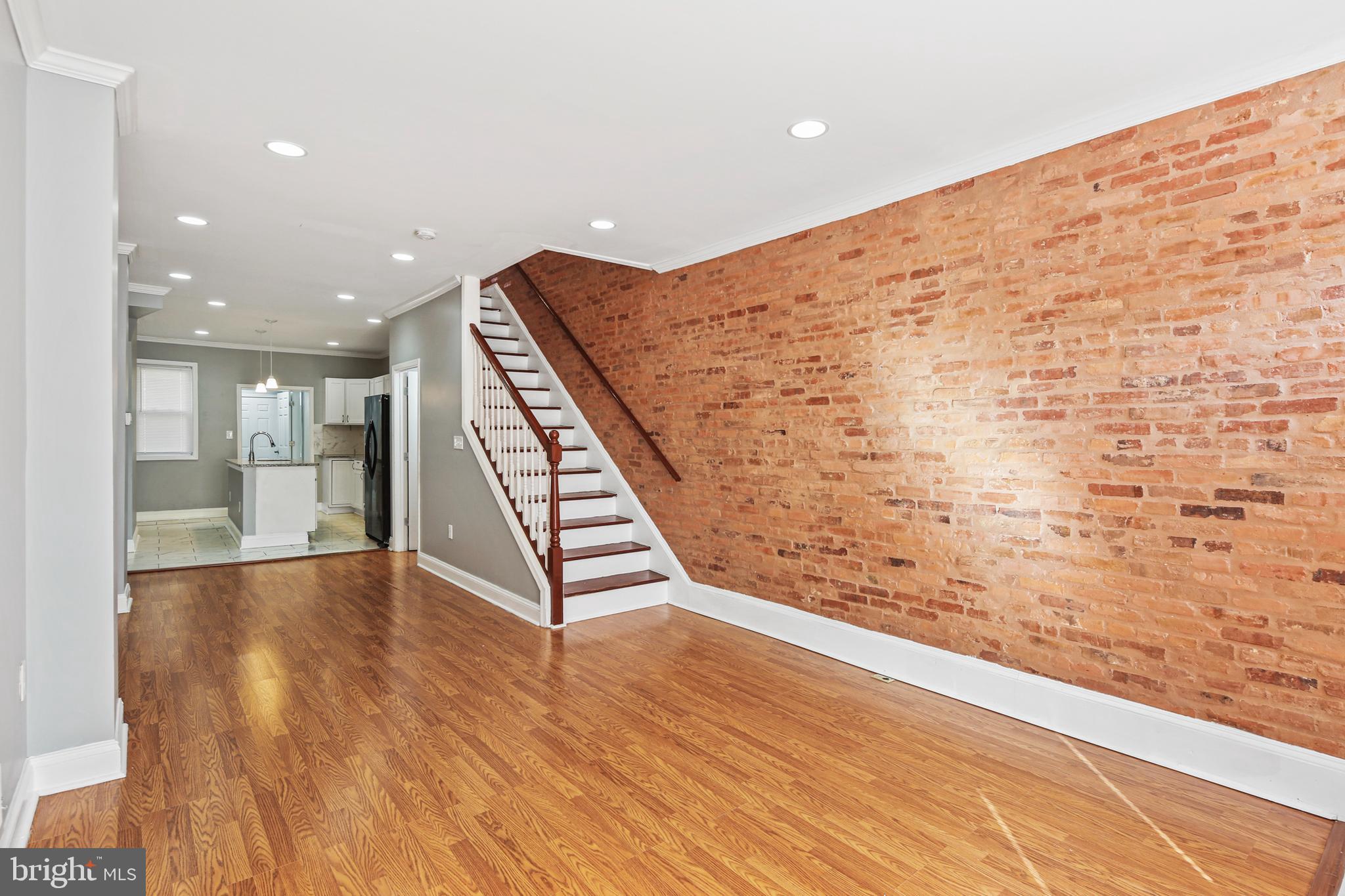 2806 Orleans Street Baltimore, MD 21224 - Photo 2 of 29 Living Room w/Charming Exposed Brick
