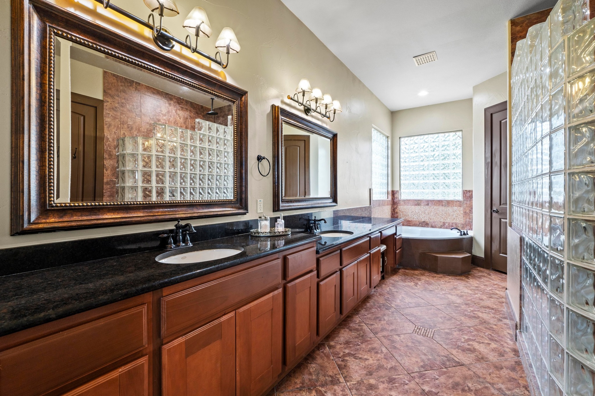 8211 Moon Rise Trail Jonestown, TX 78645 - Photo 19 of 34 Master bath offers double vanities, soaking tub, oversized shower and a great walk-in closet with custom built-ins.