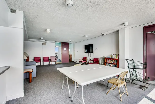 a view of a livingroom with furniture and a table