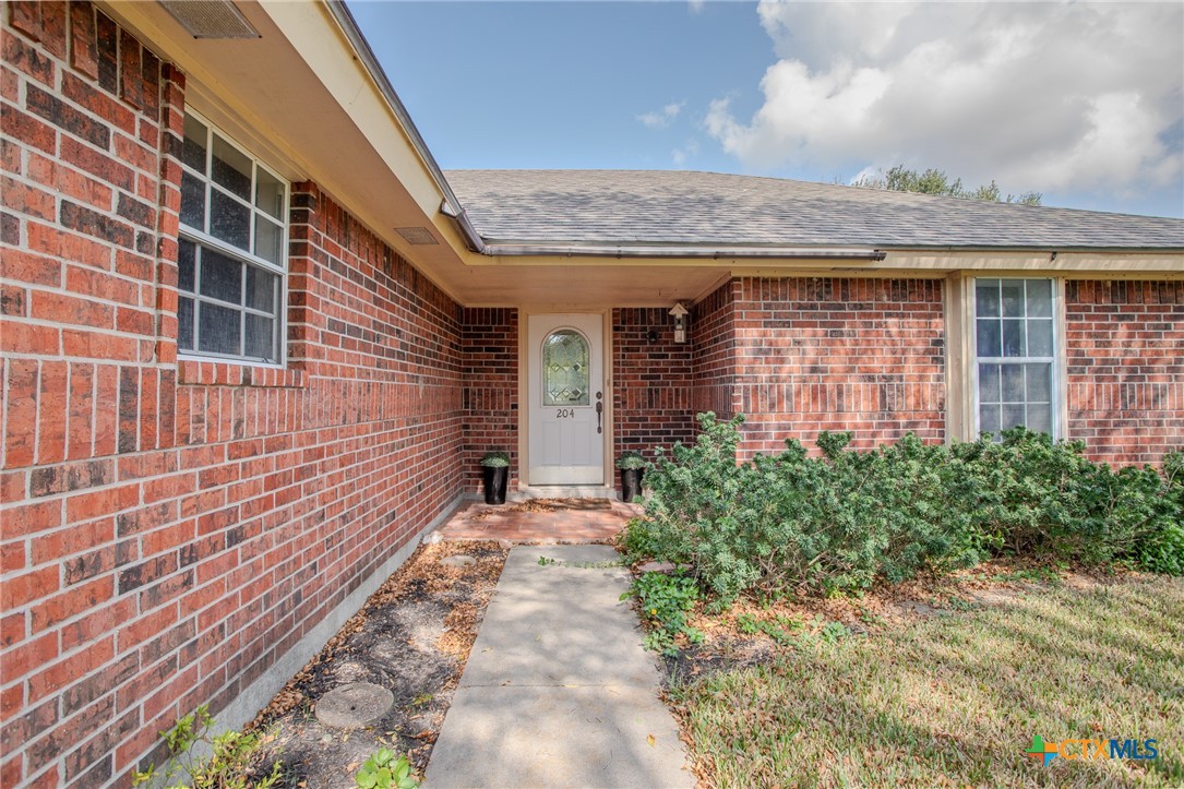 204 Grouse Road Victoria, TX 77905 - Photo 5 of 25 a view of a brick house with many windows