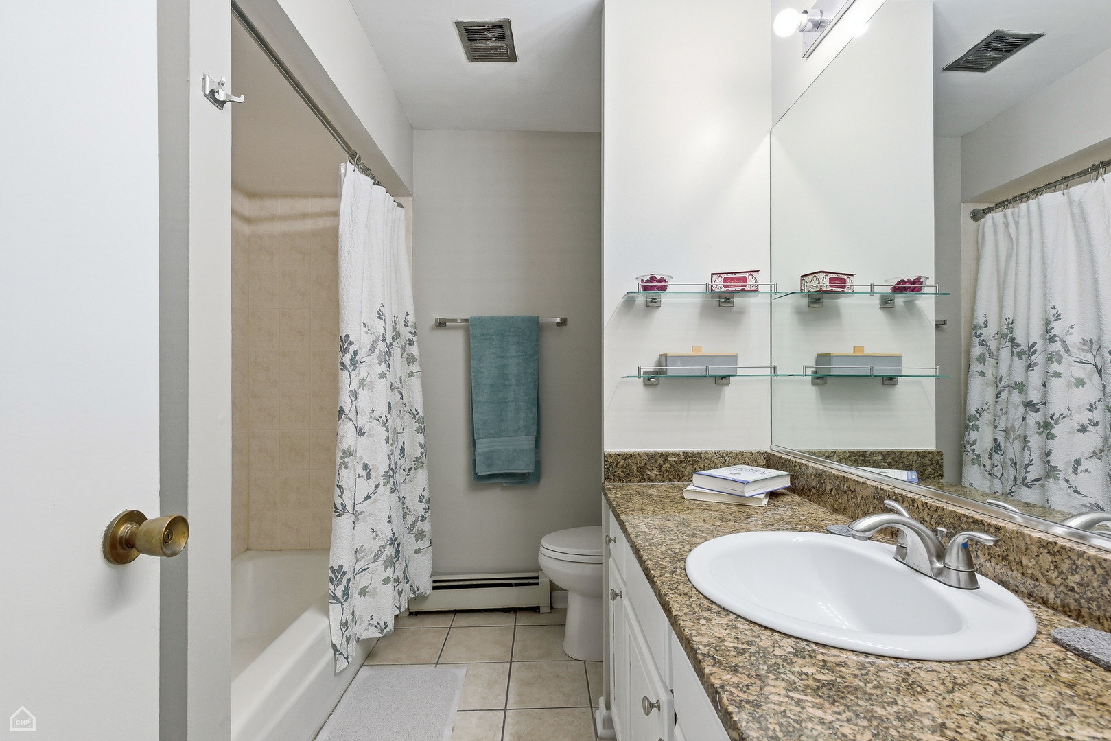 6619 North Sheridan Road, Unit 401 Chicago, IL 60626 - Photo 13 of 19 a bathroom with a granite countertop sink and a mirror
