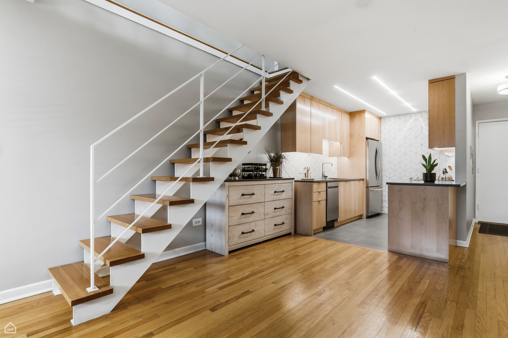 6619 North Sheridan Road, Unit 401 Chicago, IL 60626 - Photo 8 of 19 a view of hallway with stairs and wooden floor