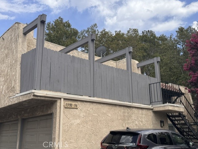 Exterior view. Upper unit is directly over it's 2 car garage.