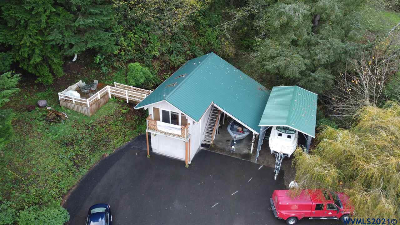 1690 Bayocean Road Northwest Tillamook, OR 97141 - Photo 1 of 25 an aerial view of a house with a yard and lake view