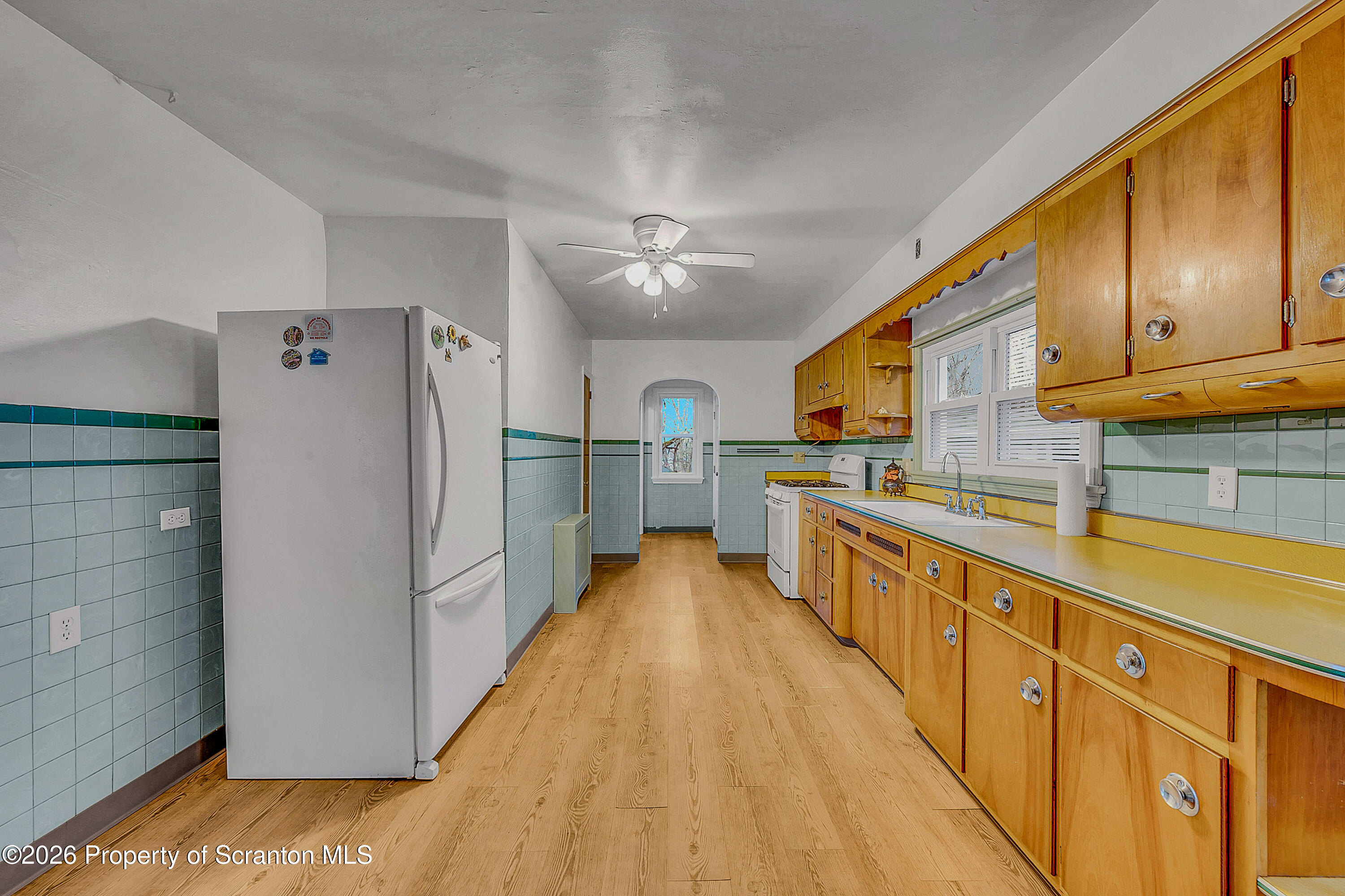123 William Street Scranton, PA 18510 - Photo 11 of 22 a kitchen with stainless steel appliances granite countertop a refrigerator a stove and a sink