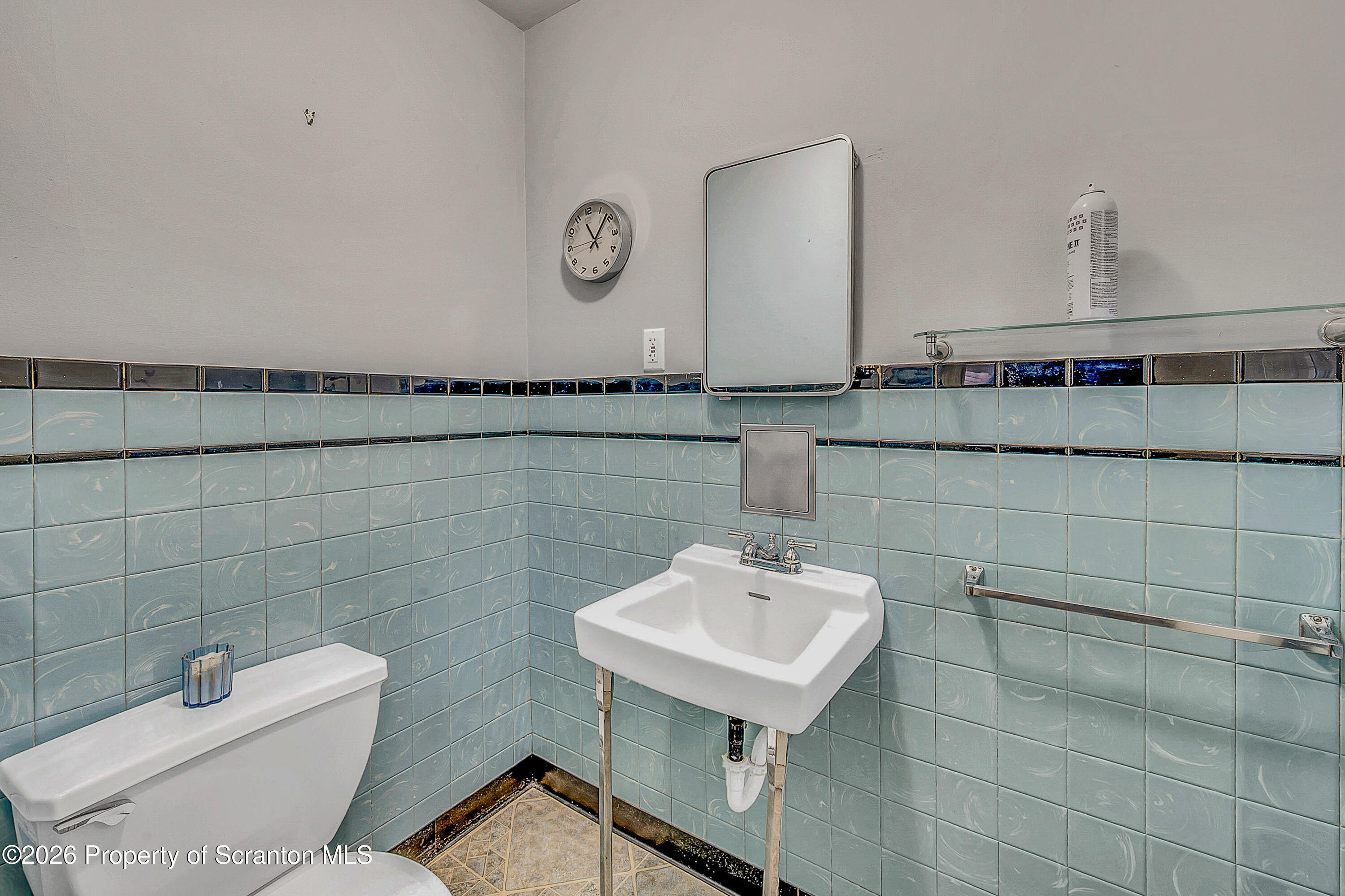 123 William Street Scranton, PA 18510 - Photo 13 of 22 a bathroom with a sink a toilet and mirror