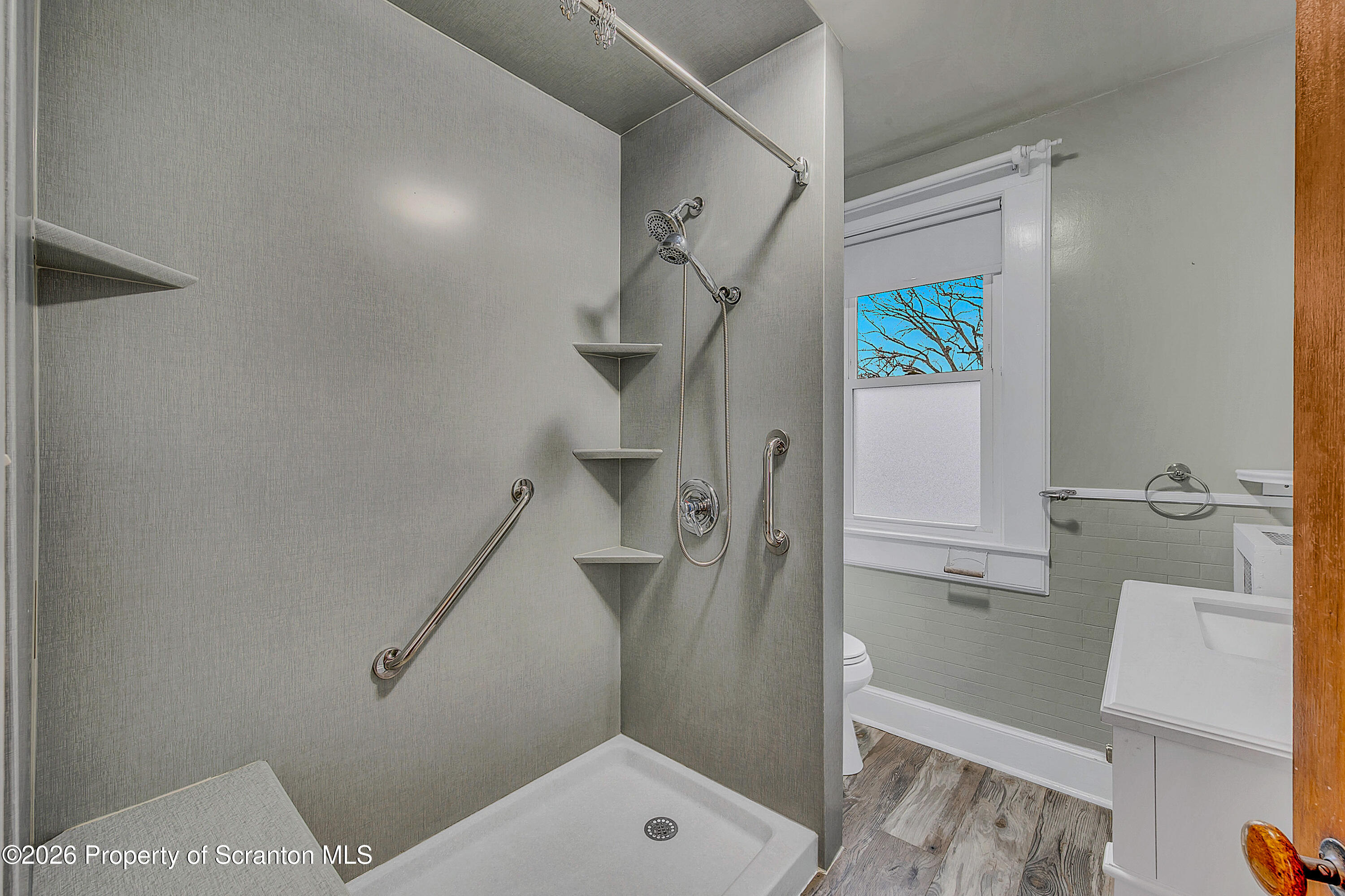 123 William Street Scranton, PA 18510 - Photo 14 of 22 a bathroom with a shower and toilet