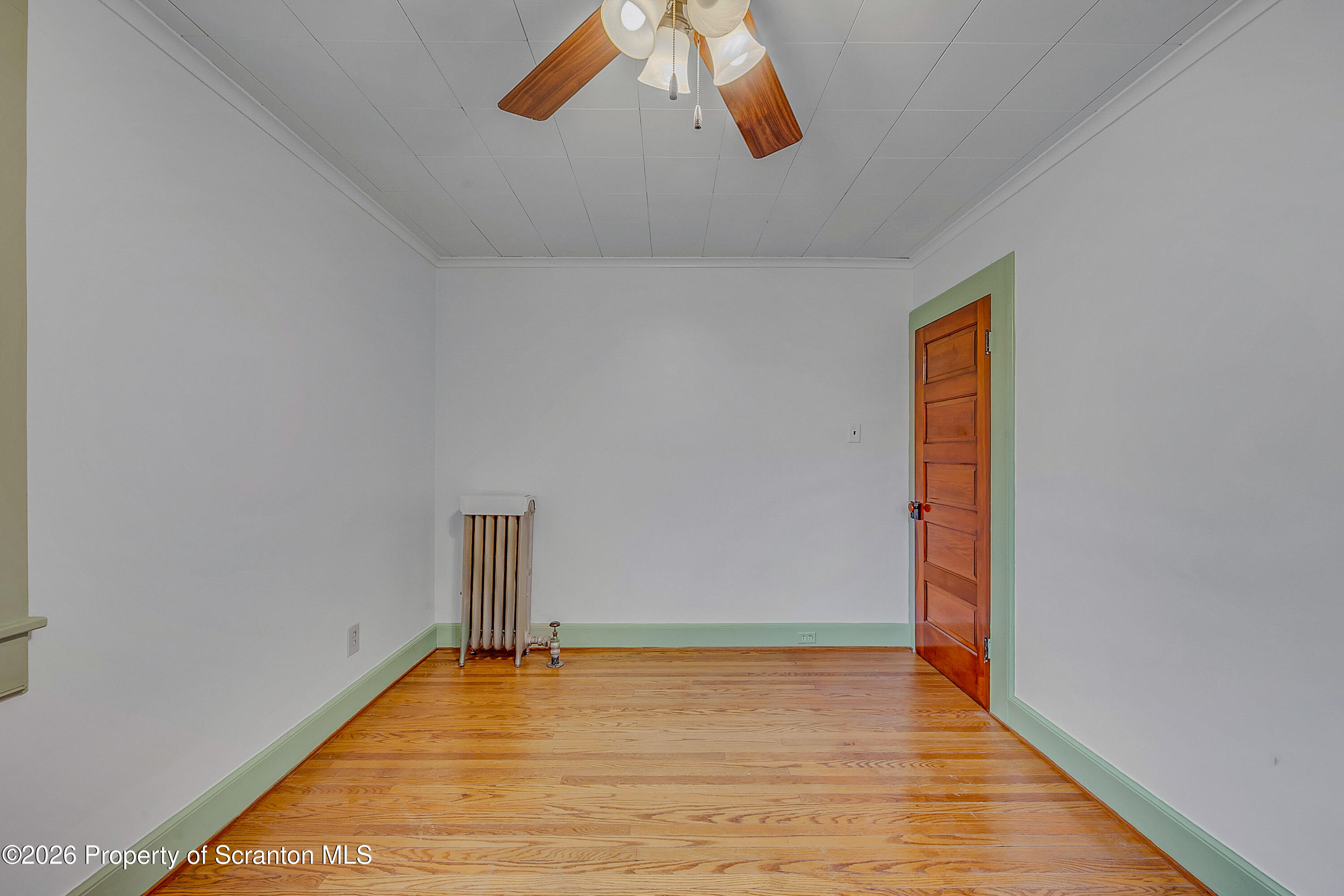 123 William Street Scranton, PA 18510 - Photo 17 of 22 a view of a room with wooden floor and white walls