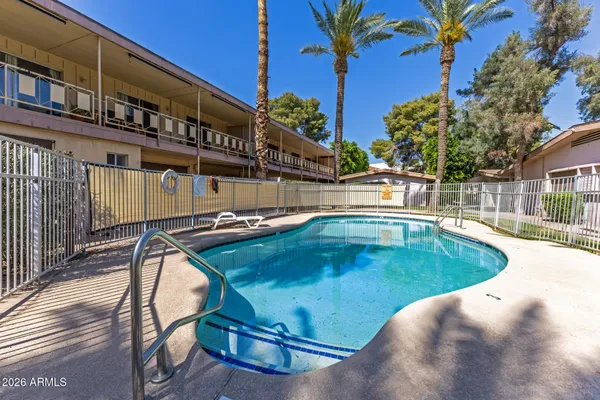 a view of a swimming pool with a patio