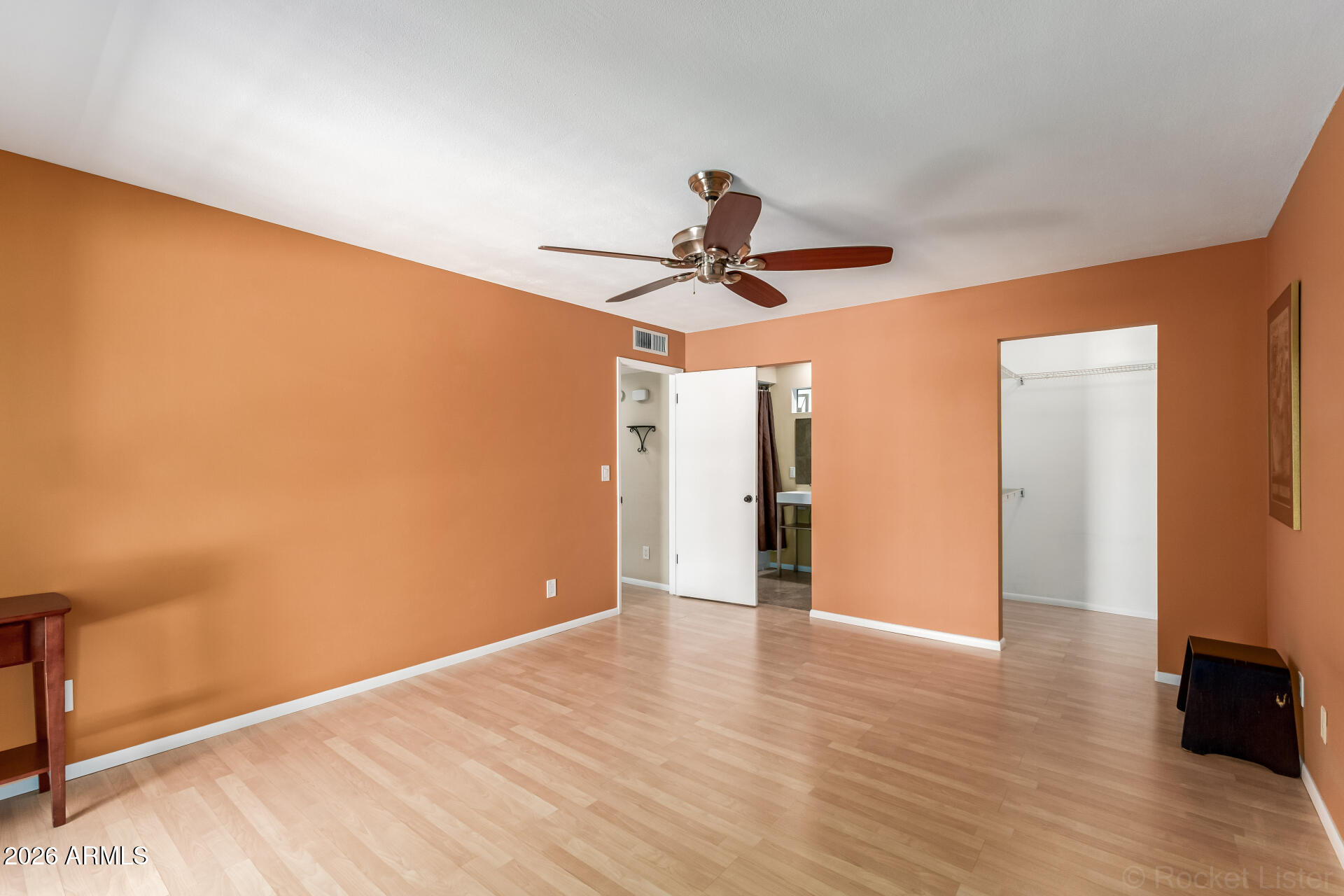 725 South Power Road, Unit 217 Mesa, AZ 85206 - Photo 14 of 29 a view of room with wooden floor and ceiling fan