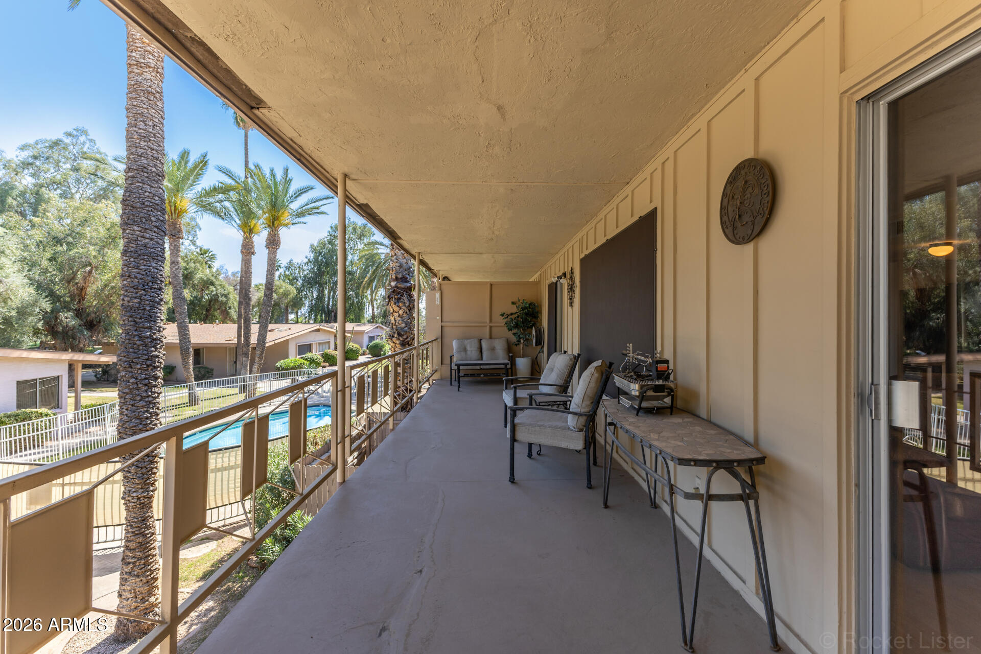 725 South Power Road, Unit 217 Mesa, AZ 85206 - Photo 22 of 29 a view of an chairs and tables in the balcony