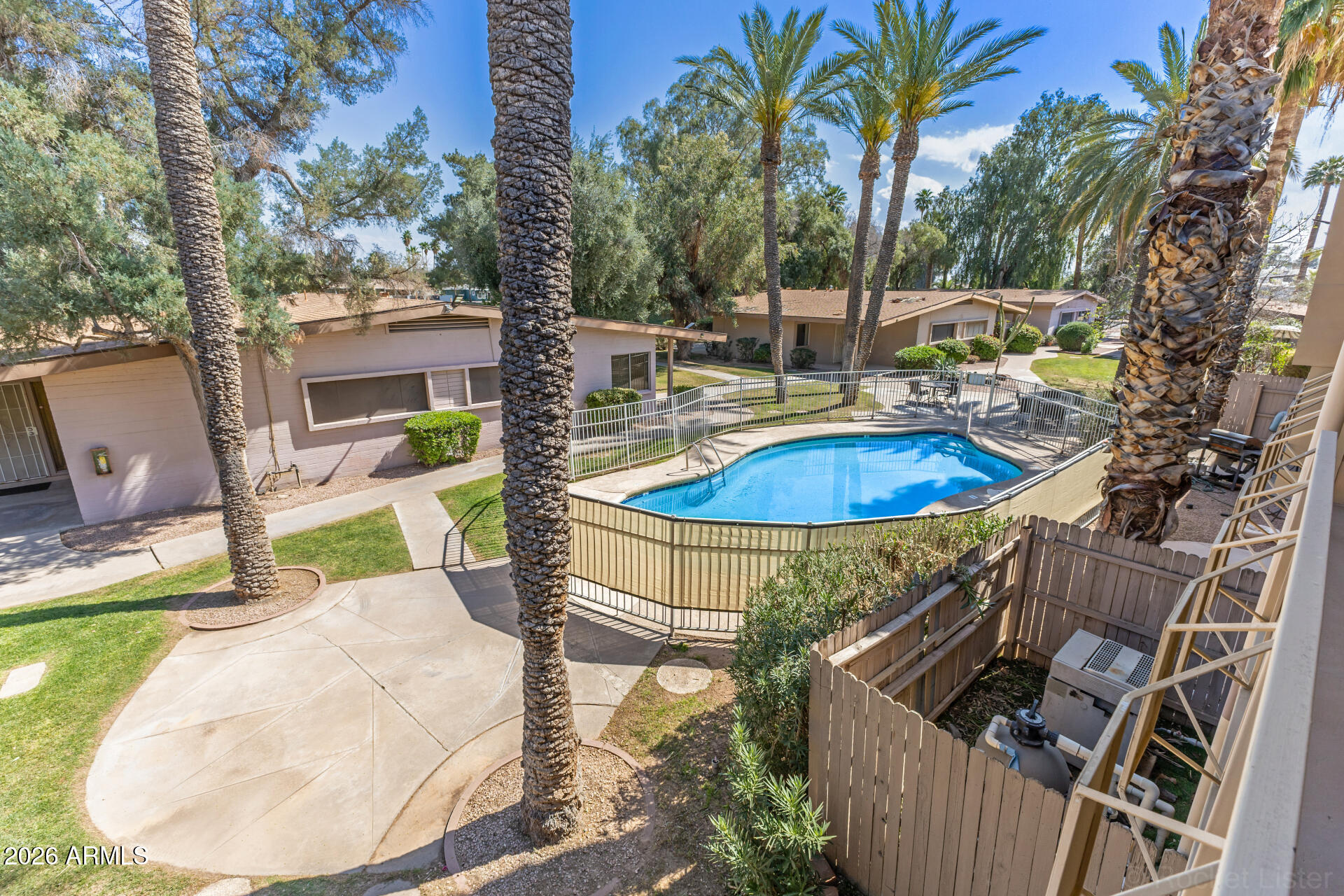 725 South Power Road, Unit 217 Mesa, AZ 85206 - Photo 24 of 29 a view of a swimming pool with a patio