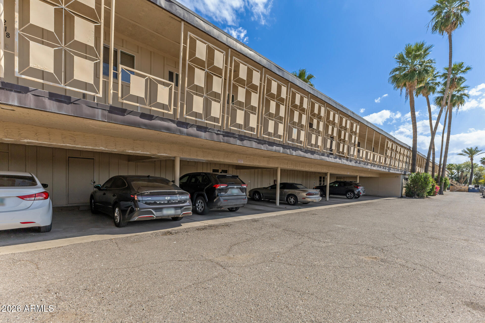 725 South Power Road, Unit 217 Mesa, AZ 85206 - Photo 25 of 29 a car parked in front of building