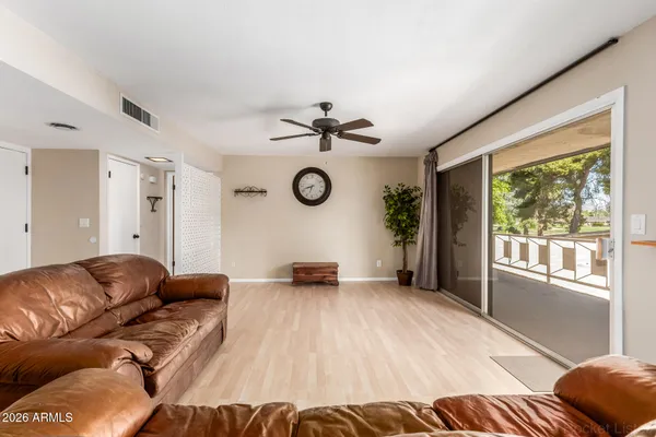 a living room with furniture and a large window