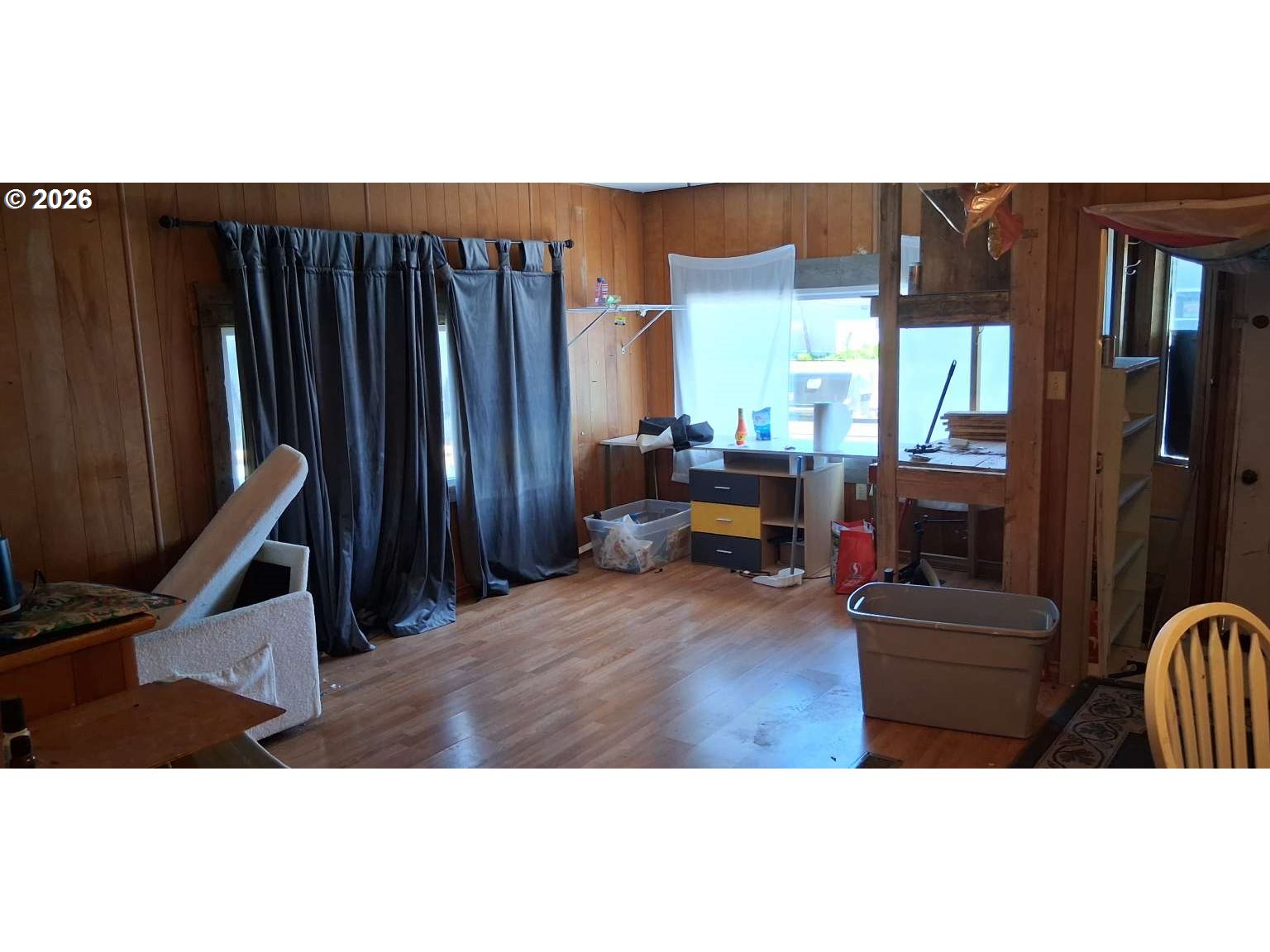 1413 Hawthorne Avenue, Unit 49 Reedsport, OR 97467 - Photo 4 of 10 a living room with furniture and a flat screen tv