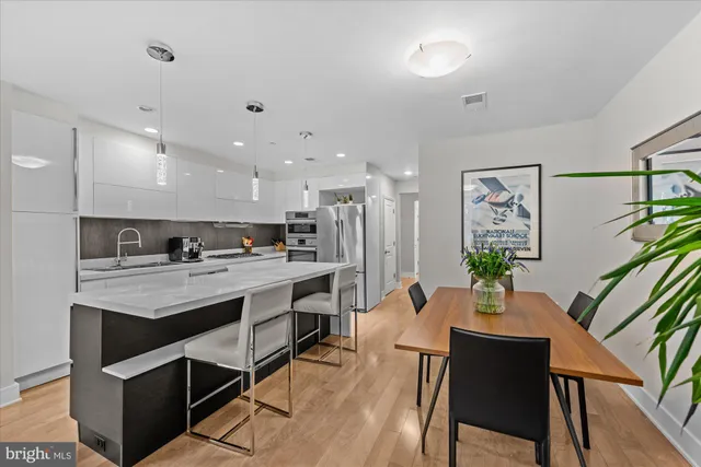 a kitchen with a table and chairs in it