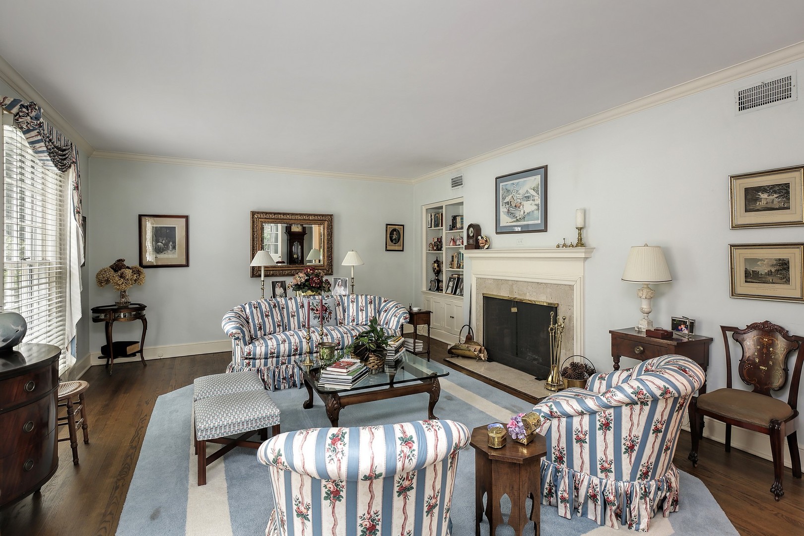 1253 Ridge Road Wilmette, IL 60091 - Photo 5 of 16 a living room with furniture fireplace and dining table
