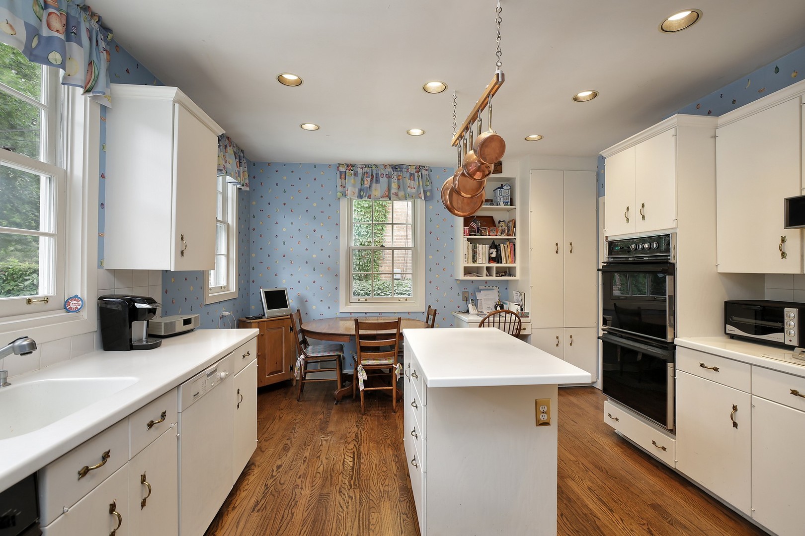 1253 Ridge Road Wilmette, IL 60091 - Photo 8 of 16 a kitchen with a sink appliances and cabinets