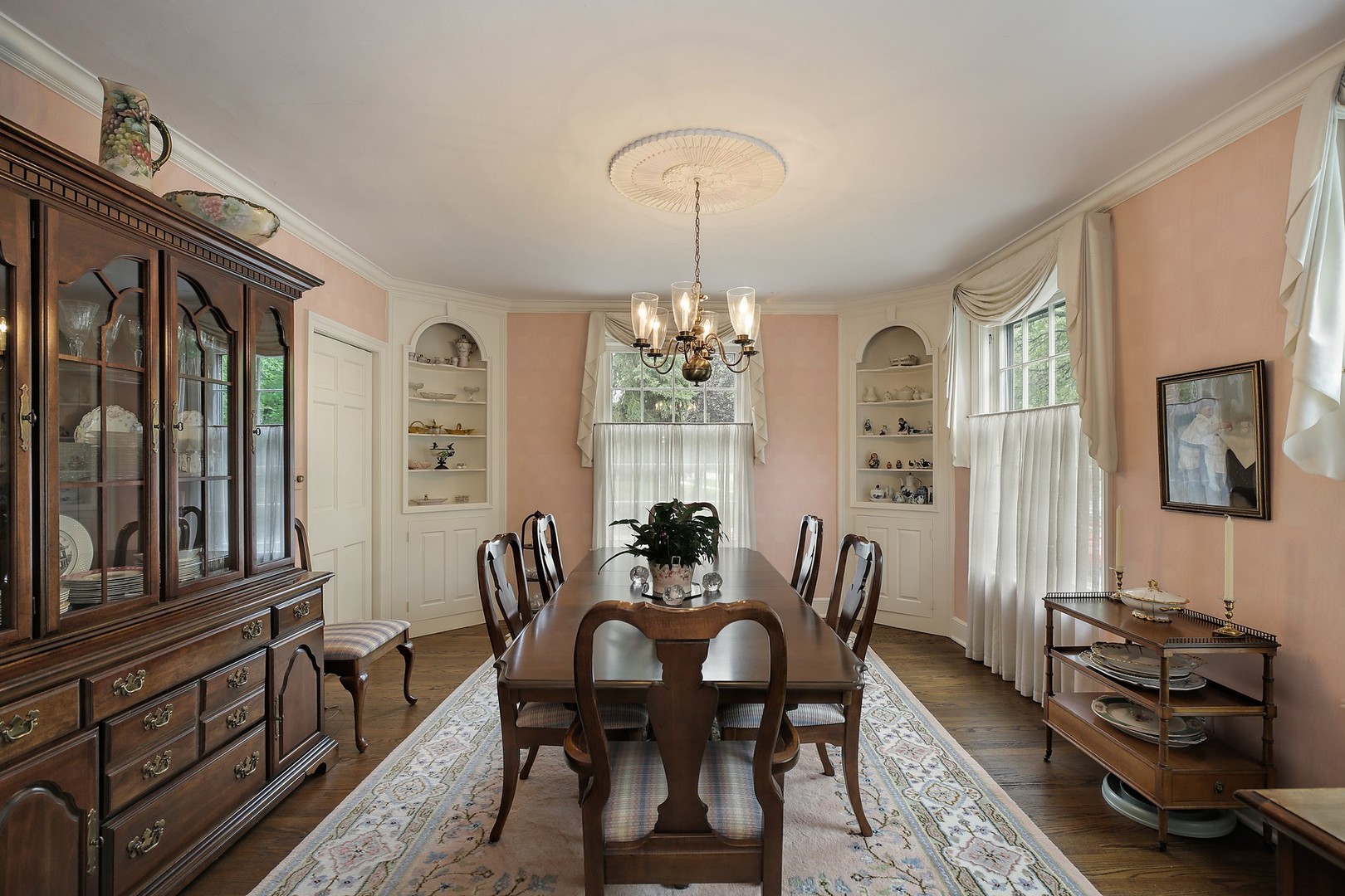 1253 Ridge Road Wilmette, IL 60091 - Photo 9 of 16 a dining room with furniture a chandelier and wooden floor