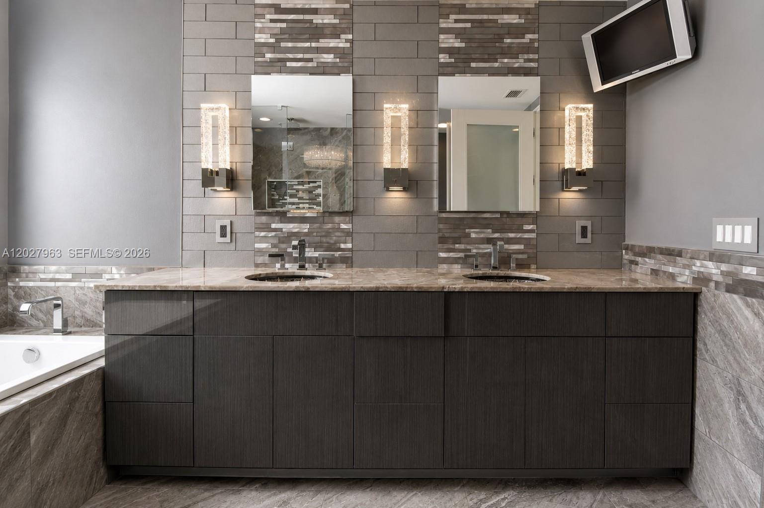 6646 Northwest 25th Terrace Boca Raton, FL 33496 - Photo 29 of 48 a bathroom with a sink and a mirror