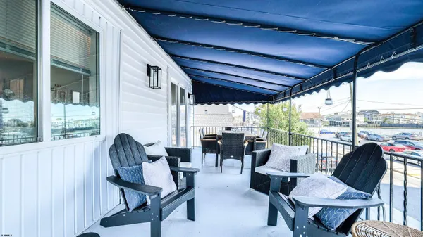 a view of roof deck with seating space and barbeque oven