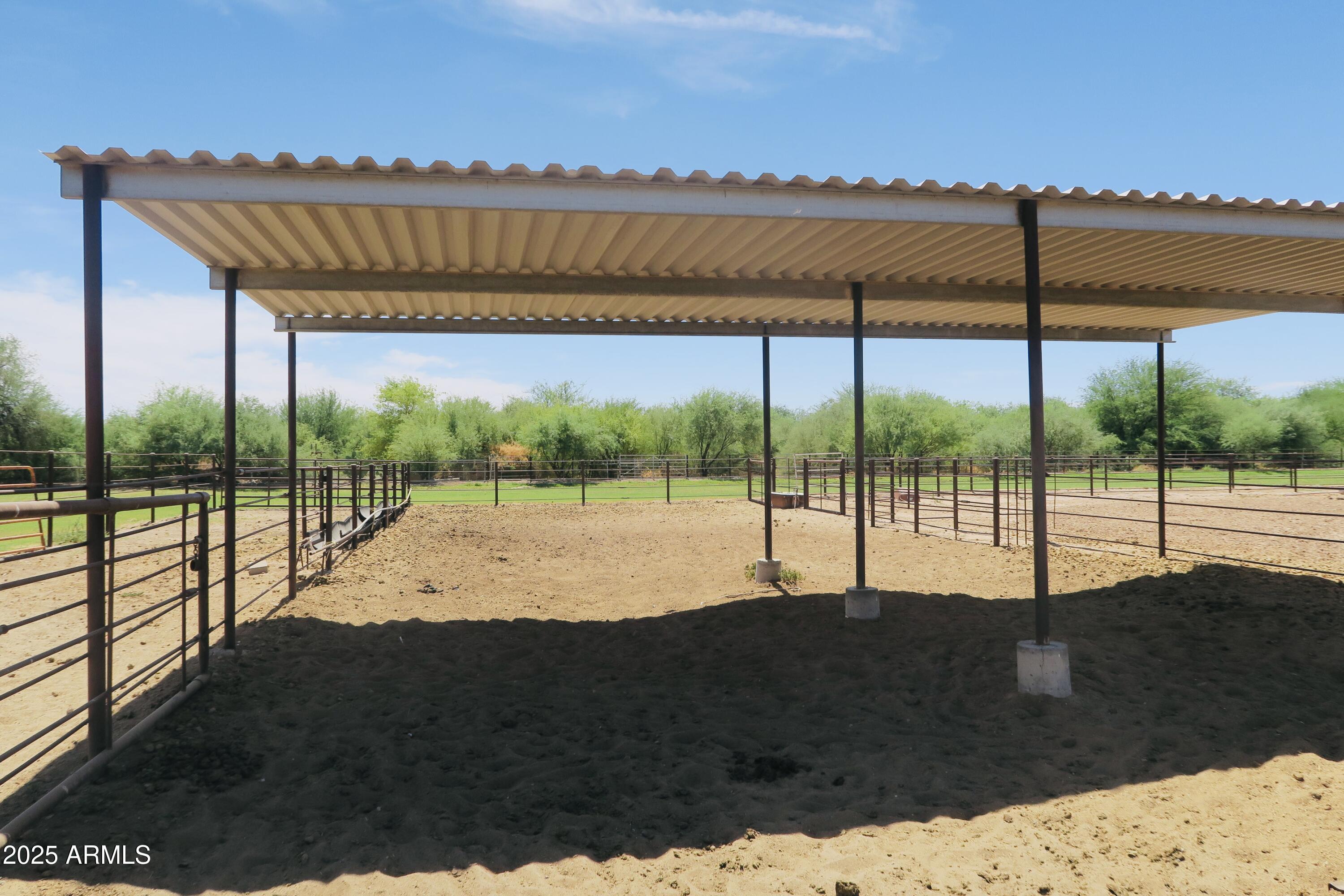 9208 South Palo Verde Road Buckeye, AZ 85326 - Photo 11 of 27 a view of a swimming pool with a porch