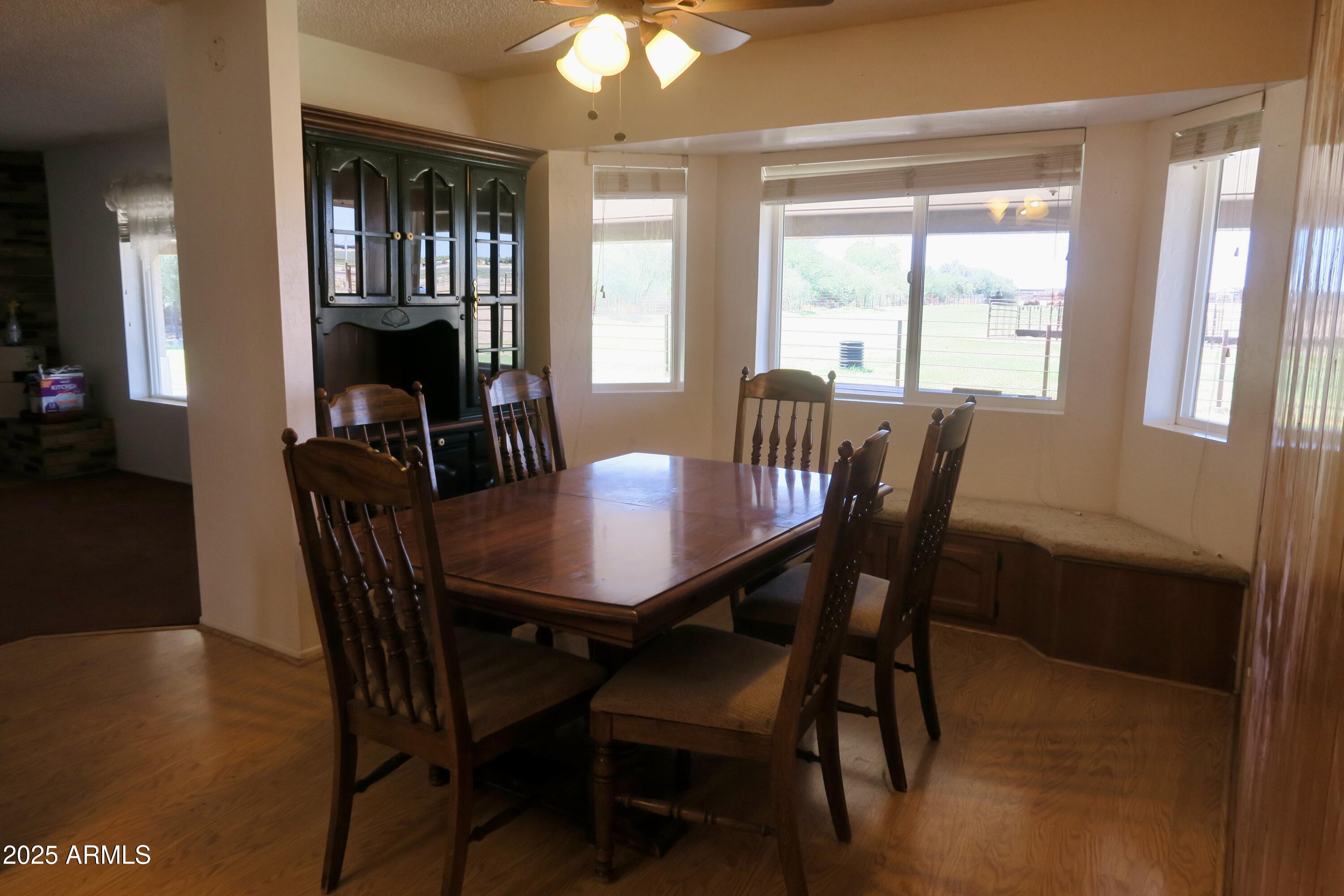 9208 South Palo Verde Road Buckeye, AZ 85326 - Photo 17 of 27 a view of a dining room with furniture and window