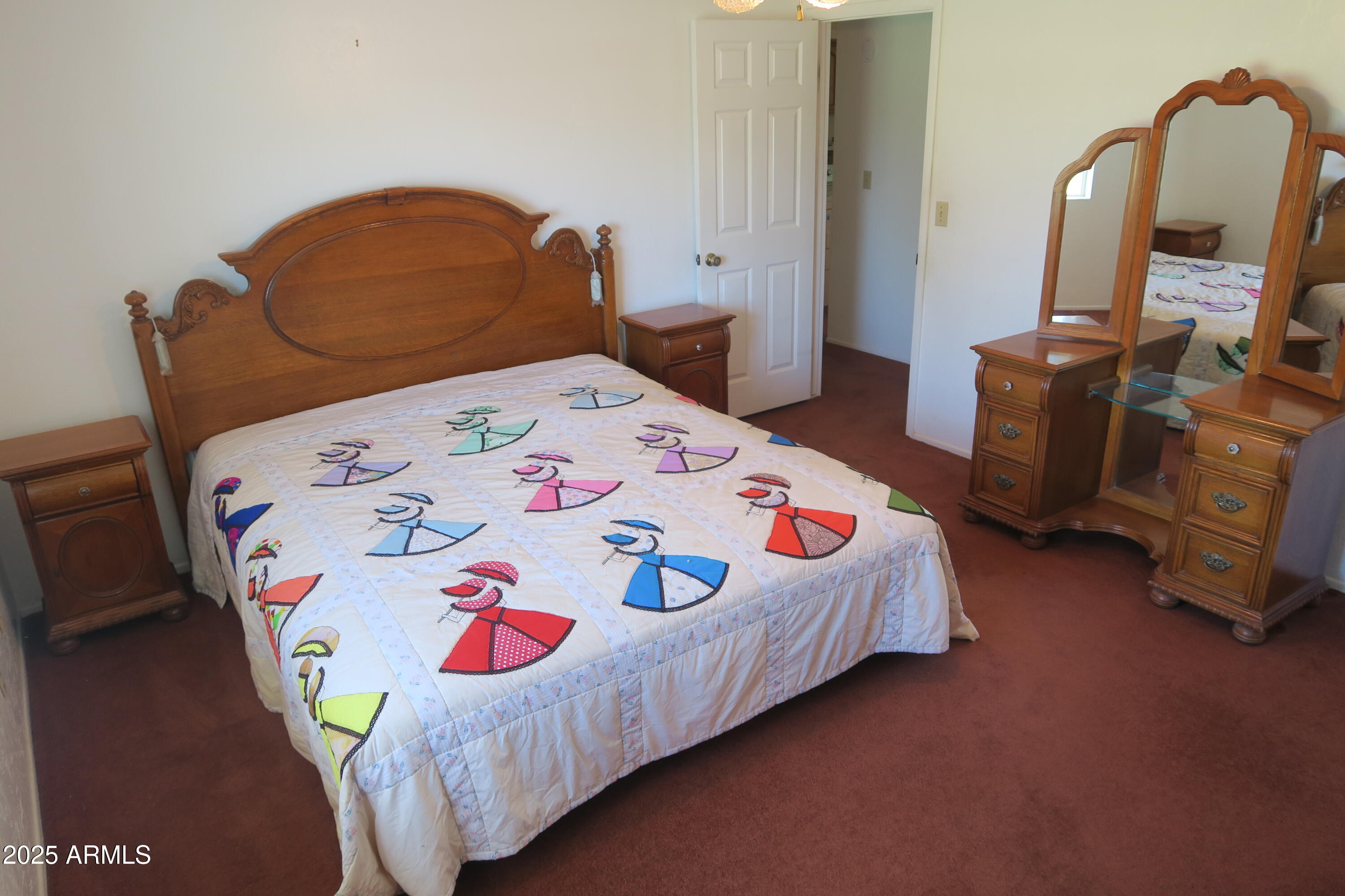 9208 South Palo Verde Road Buckeye, AZ 85326 - Photo 20 of 27 a bedroom with a bed and a dresser