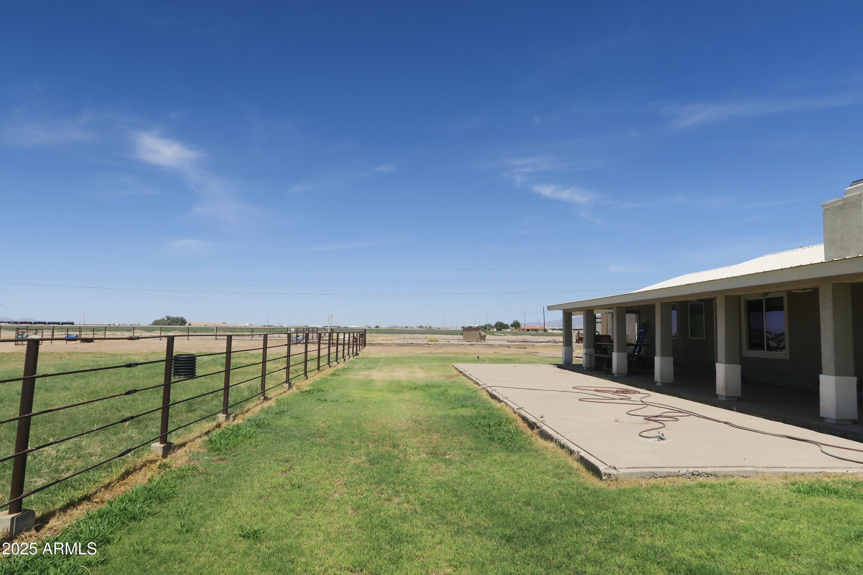 9208 South Palo Verde Road Buckeye, AZ 85326 - Photo 4 of 27 a view of an ocean with a big yard