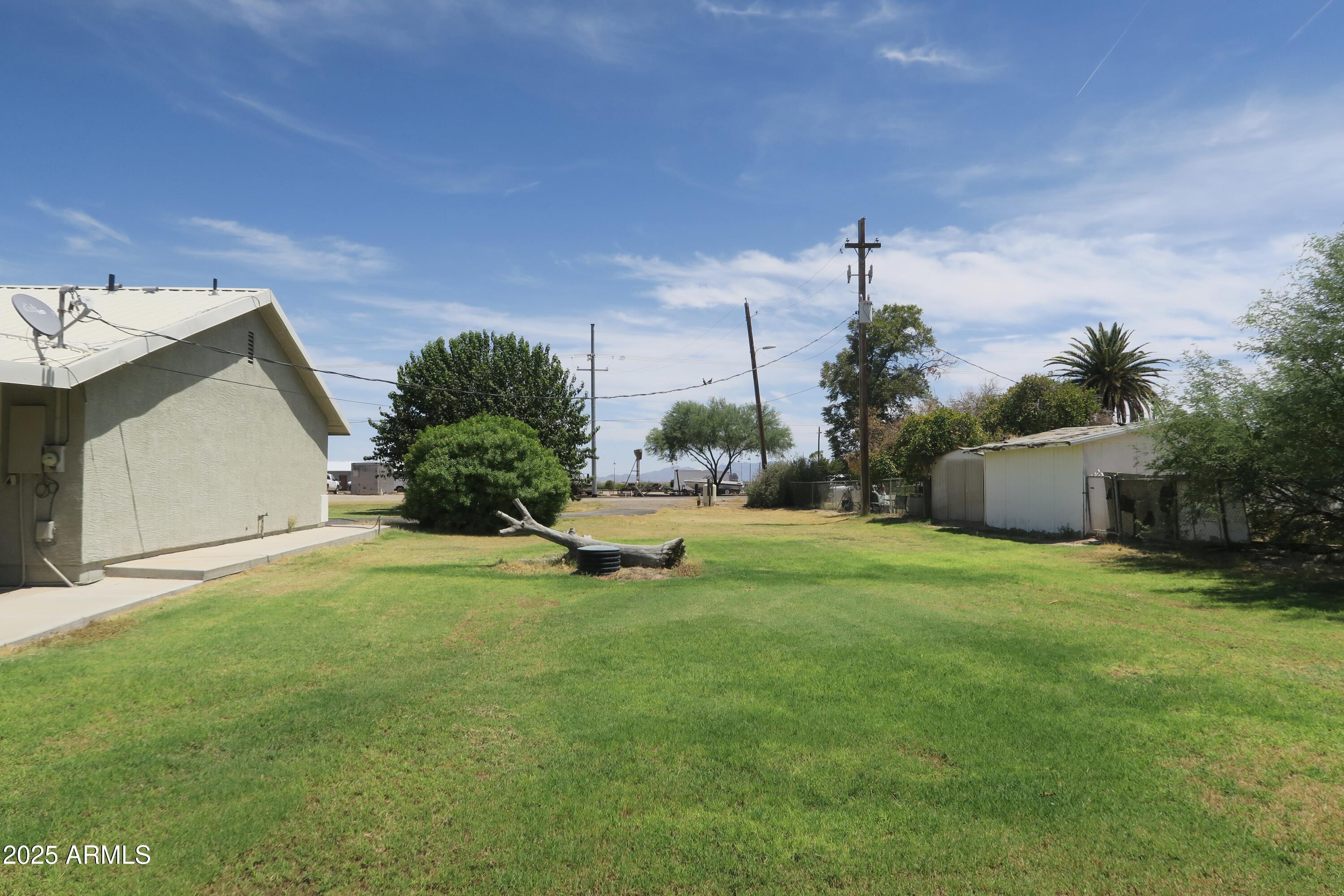 9208 South Palo Verde Road Buckeye, AZ 85326 - Photo 5 of 27 a view of a house with a yard and a patio