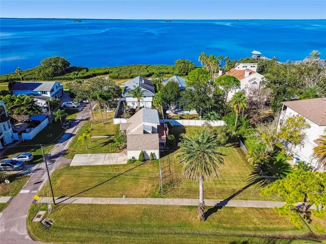 a view of a swimming pool with a table and chairs