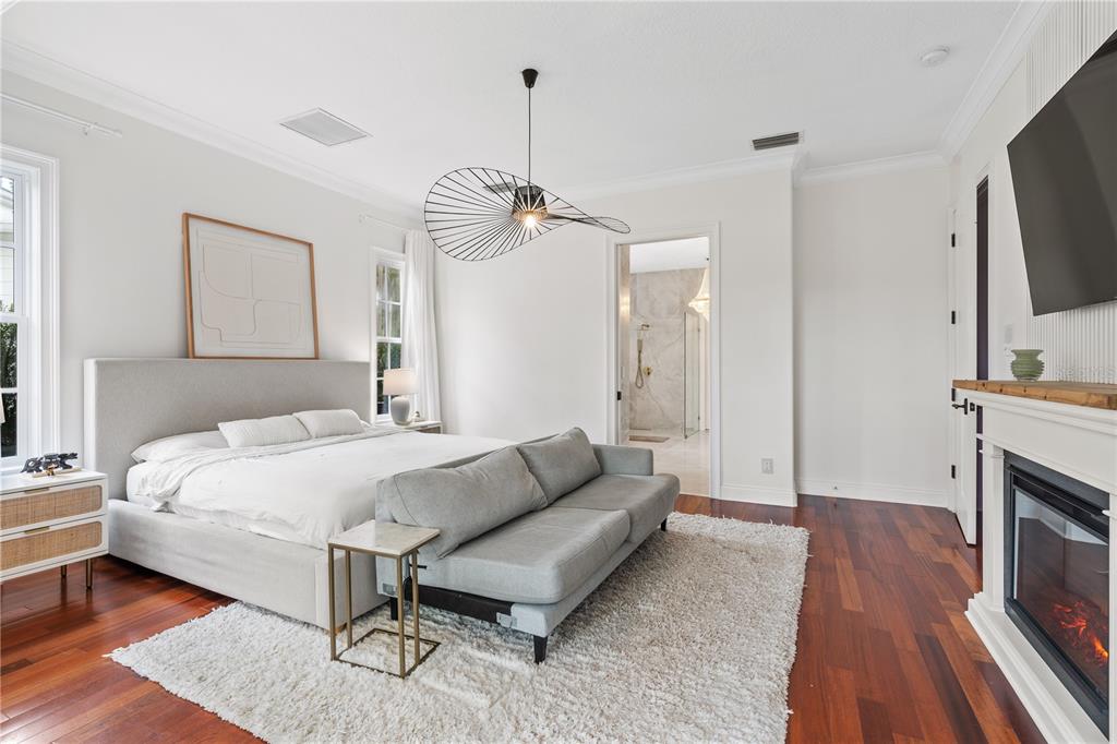 222 Acadia Terrace Celebration, FL 34747 - Photo 22 of 76 a spacious bedroom with a bed and a flat screen tv