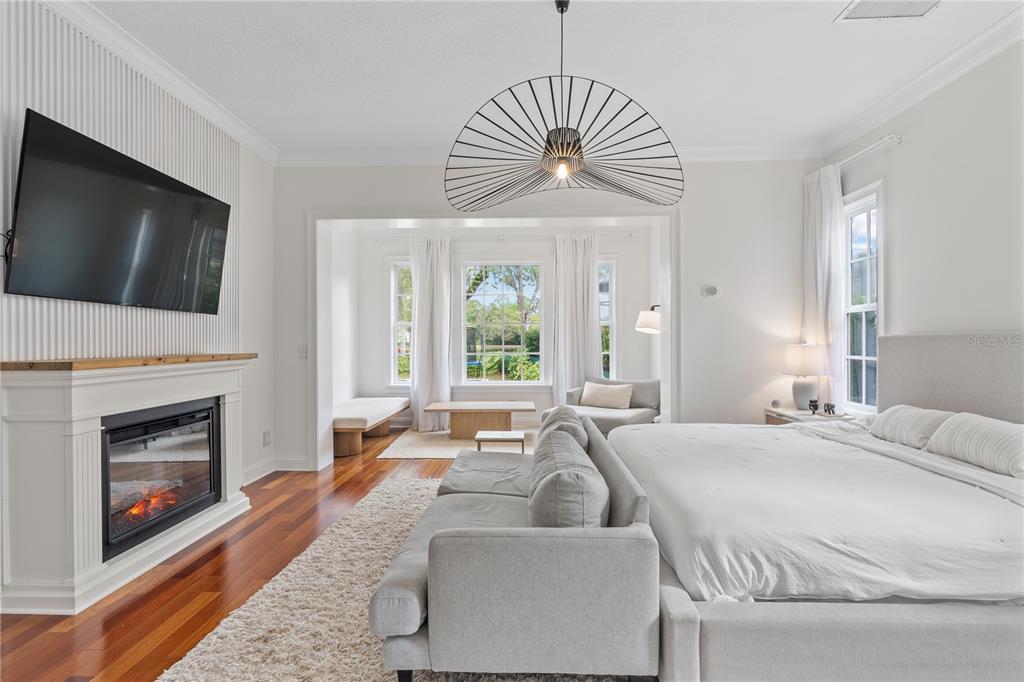 222 Acadia Terrace Celebration, FL 34747 - Photo 23 of 76 a living room with furniture a fireplace and a flat screen tv