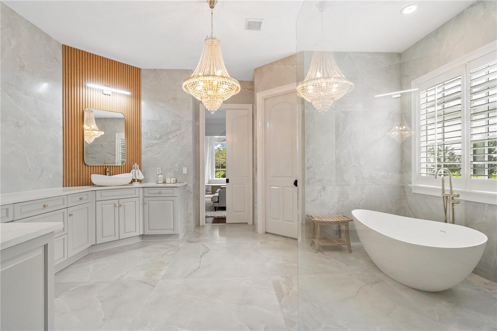 222 Acadia Terrace Celebration, FL 34747 - Photo 30 of 76 a spacious bathroom with a double vanity sink and a mirror