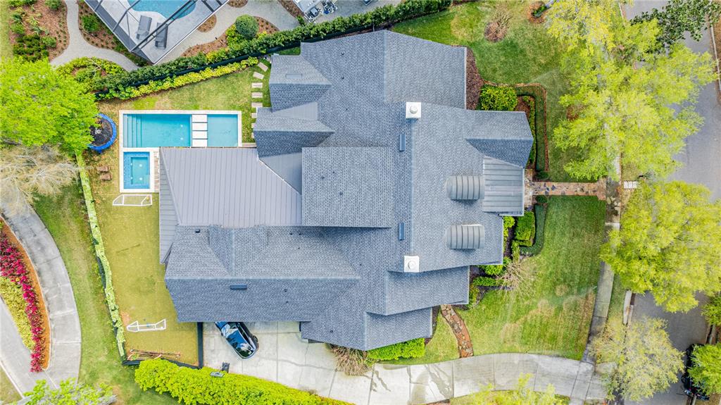 222 Acadia Terrace Celebration, FL 34747 - Photo 3 of 76 an aerial view of a house with a yard basket ball court and outdoor seating