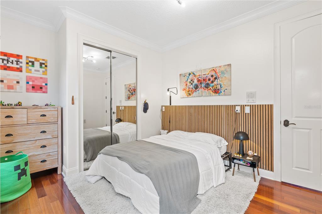 222 Acadia Terrace Celebration, FL 34747 - Photo 34 of 76 a bedroom with a bed and a cabinets