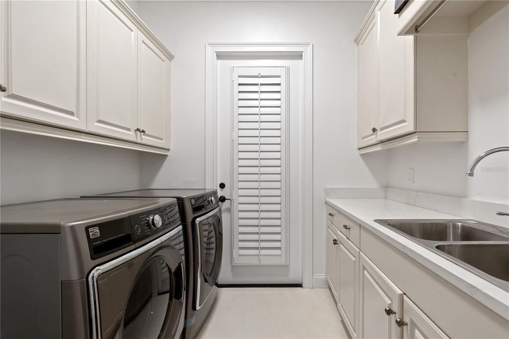 222 Acadia Terrace Celebration, FL 34747 - Photo 47 of 76 a kitchen with granite countertop a sink and a stove
